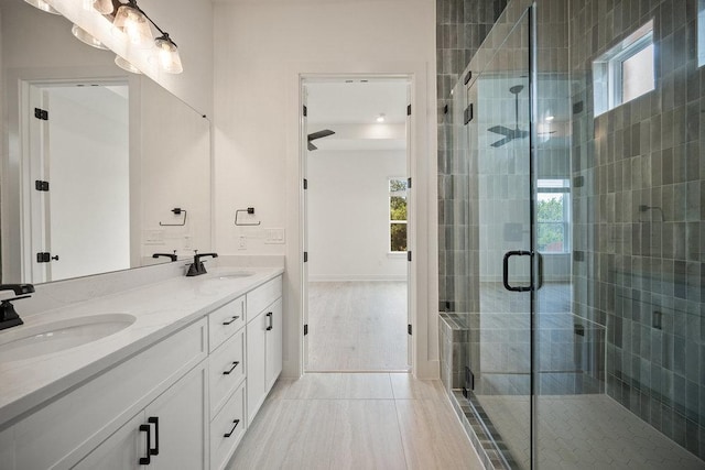 1601 Cardinal Ln, Round Rock, TX 78681 - bathroom with healthy amount of natural light, double vanity, and a stall shower