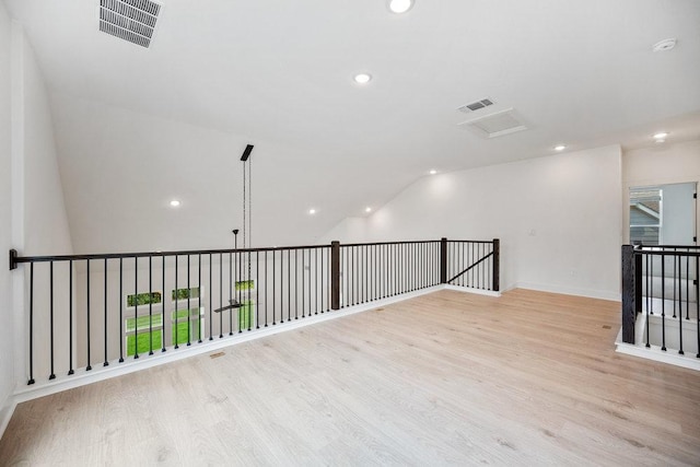 1601 Cardinal Ln, Round Rock, TX 78681 - unfurnished room with wood finished floors, recessed lighting, and vaulted ceiling