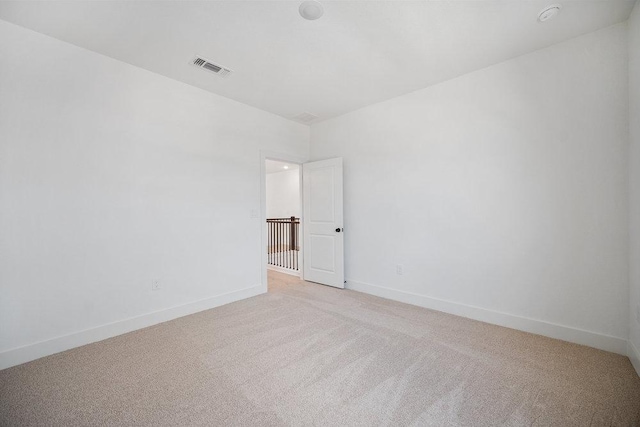 1601 Cardinal Ln, Round Rock, TX 78681 - spare room featuring light colored carpet and baseboards