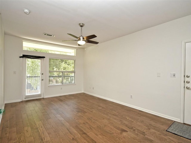 2209 Hancock Dr Unit 4, Austin, TX 78756 - empty room with ceiling fan, dark wood-style floors, and baseboards