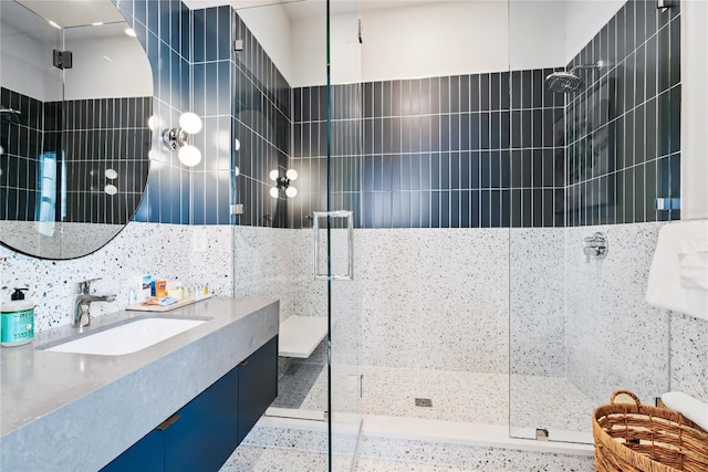 full bathroom with vanity and walk in shower