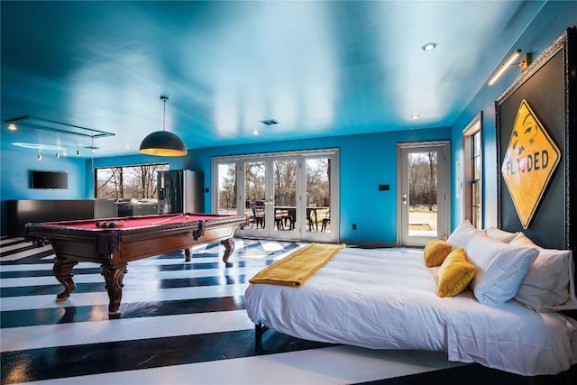 bedroom featuring visible vents, stainless steel fridge with ice dispenser, pool table, access to exterior, and rail lighting