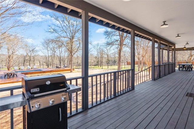 deck featuring a grill