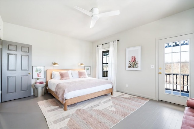 bedroom featuring access to outside, multiple windows, baseboards, and ceiling fan