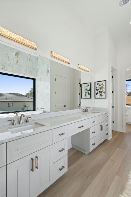 3113 Stableford Cv, Spicewood, TX 78669 - full bath featuring double vanity and wood finished floors