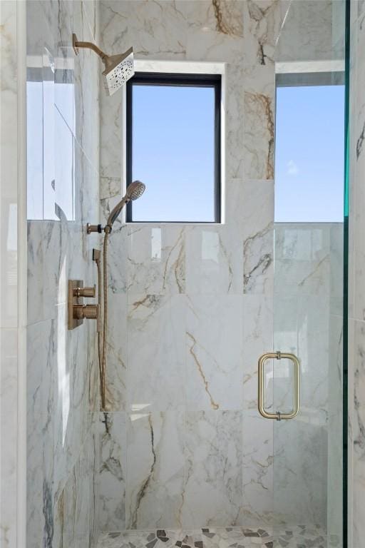 3113 Stableford Cv, Spicewood, TX 78669 - full bathroom with a marble finish shower and plenty of natural light