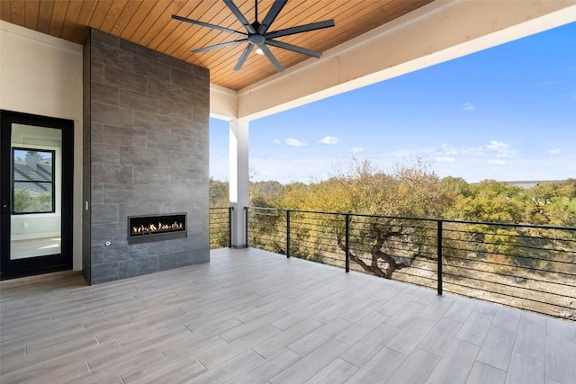3113 Stableford Cv, Spicewood, TX 78669 - view of patio / terrace with ceiling fan and a tile fireplace