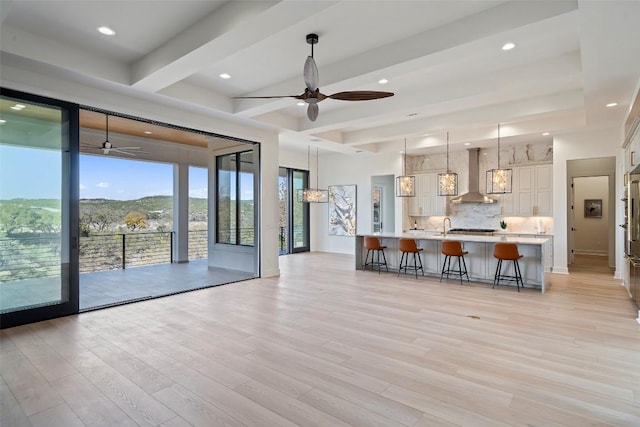 3113 Stableford Cv, Spicewood, TX 78669 - living area with ceiling fan, light wood-style flooring, recessed lighting, and beam ceiling