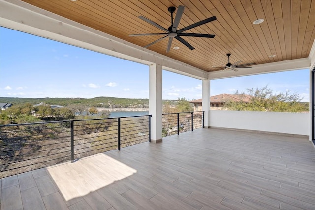 3113 Stableford Cv, Spicewood, TX 78669 - wooden terrace with a ceiling fan and a water view