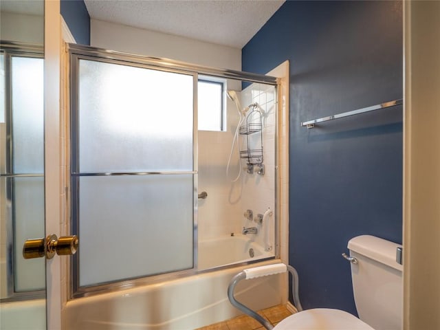 3379 S El Dorado, Lakeway, TX 78734 - full bathroom featuring combined bath / shower with glass door, toilet, and a textured ceiling