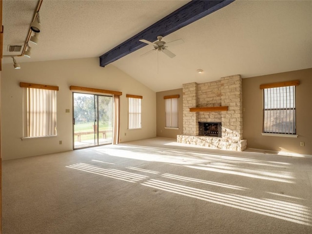 3379 S El Dorado, Lakeway, TX 78734 - unfurnished living room with a fireplace, carpet, a ceiling fan, rail lighting, and a textured ceiling