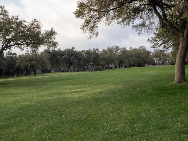 3379 S El Dorado, Lakeway, TX 78734 - view of home's community featuring a yard and view of wooded area