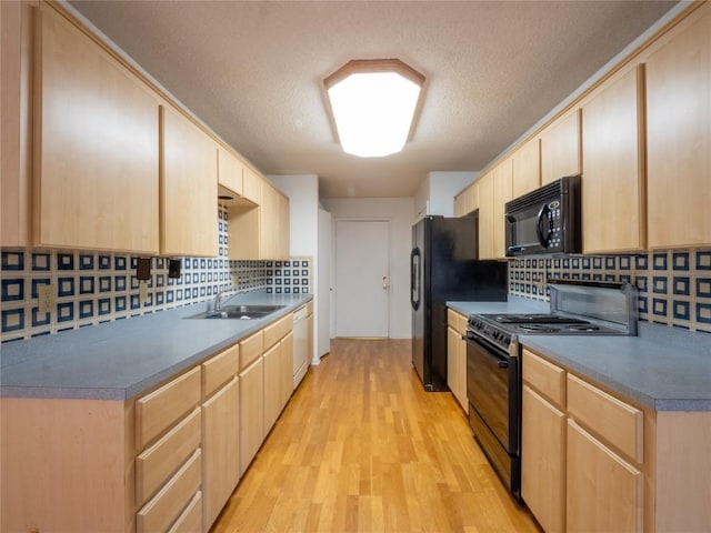 3379 S El Dorado, Lakeway, TX 78734 - kitchen featuring black appliances, light brown cabinets, a sink, light wood finished floors, and backsplash