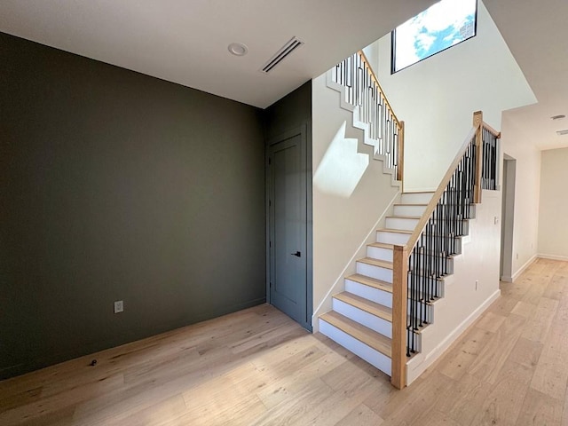 705 E 50th St, Austin, TX 78751 - stairs with visible vents, baseboards, and wood finished floors