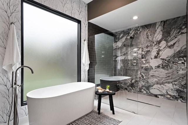 705 E 50th St, Austin, TX 78751 - bathroom featuring a freestanding bath, walk in shower, and tile walls