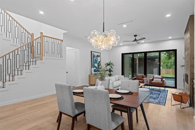 705 E 50th St, Austin, TX 78751 - dining area with light wood finished floors, stairs, ceiling fan, recessed lighting, and a chandelier