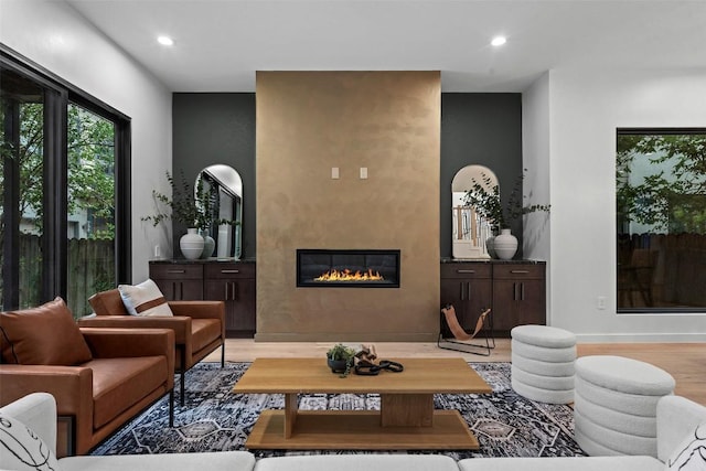 705 E 50th St, Austin, TX 78751 - living area featuring a large fireplace, light wood-style flooring, and recessed lighting