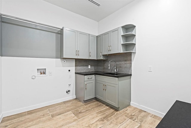 705 E 50th St, Austin, TX 78751 - laundry area featuring gas dryer hookup, electric dryer hookup, hookup for a washing machine, and light wood finished floors