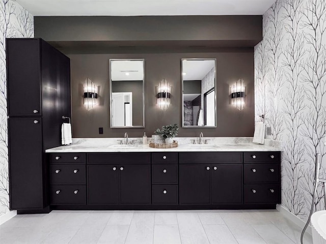 705 E 50th St, Austin, TX 78751 - full bath with wallpapered walls, an accent wall, and double vanity