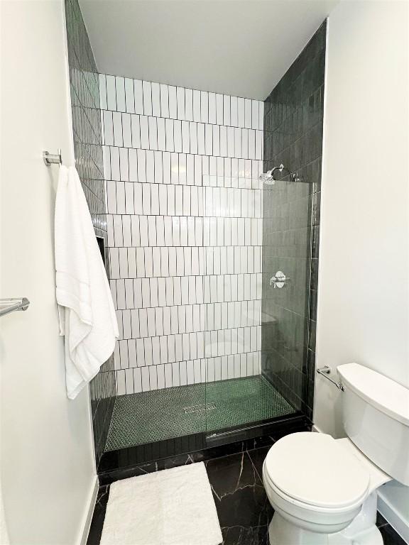 705 E 50th St, Austin, TX 78751 - bathroom featuring toilet and a tile shower