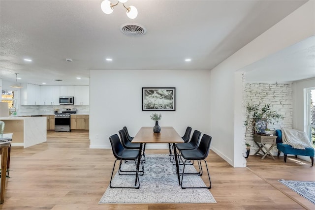 11704 Indianhead Dr, Austin, TX 78753 - dining space with light wood-type flooring and recessed lighting