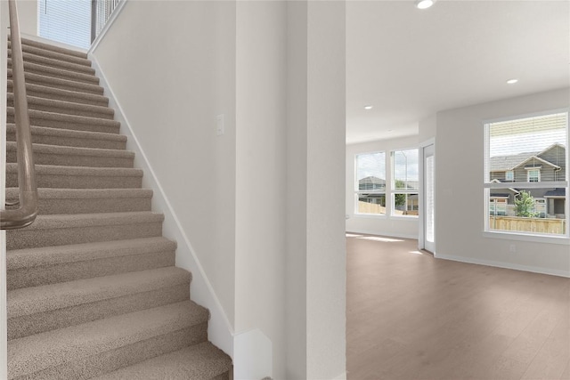 2705 Sage Ranch Dr Unit 26, Leander, TX 78641 - stairway featuring wood finished floors, recessed lighting, and baseboards