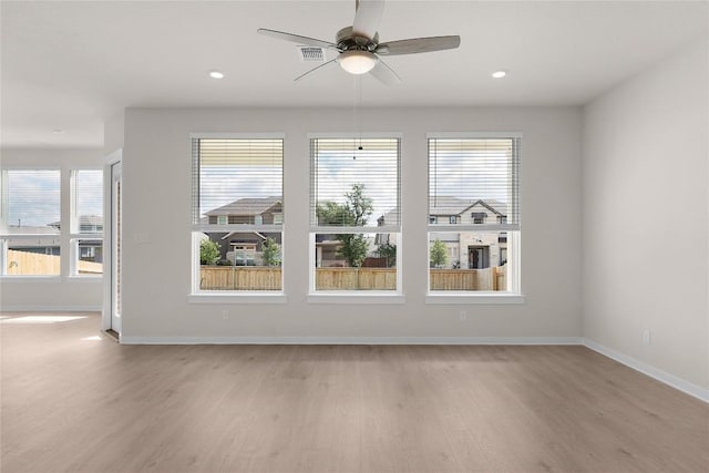 2705 Sage Ranch Dr Unit 26, Leander, TX 78641 - unfurnished dining area with light wood-type flooring, plenty of natural light, baseboards, a ceiling fan, and recessed lighting