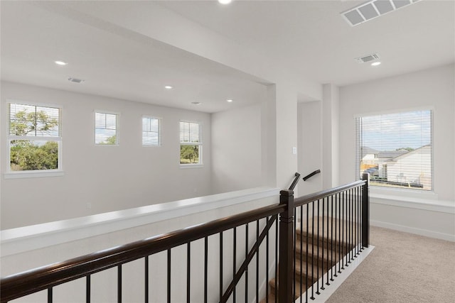 2705 Sage Ranch Dr Unit 26, Leander, TX 78641 - hall with an upstairs landing, carpet, recessed lighting, and baseboards