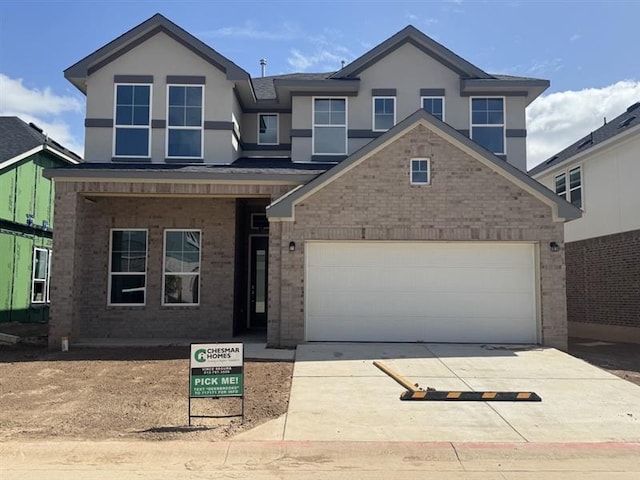 2705 Sage Ranch Dr Unit 26, Leander, TX 78641 - traditional-style home with driveway, brick siding, a garage, and stucco siding