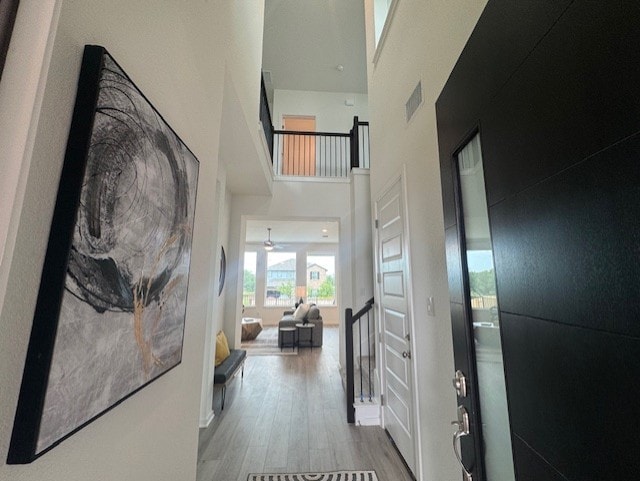 2705 Sage Ranch Dr Unit 26, Leander, TX 78641 - hall with a high ceiling and wood finished floors