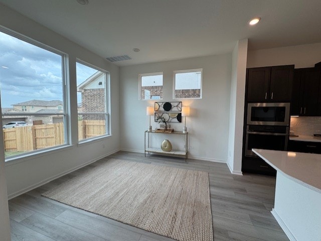 2705 Sage Ranch Dr Unit 26, Leander, TX 78641 - dining room featuring light wood finished floors and recessed lighting