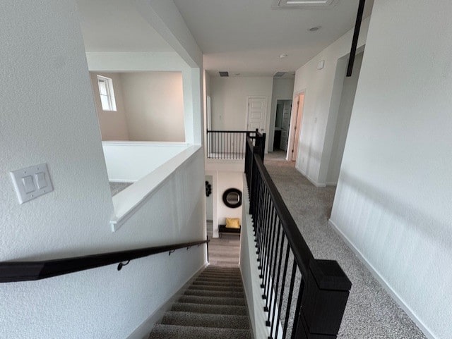 2705 Sage Ranch Dr Unit 26, Leander, TX 78641 - stairs with carpet floors and a textured wall