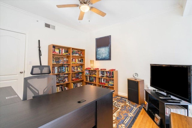 home office featuring visible vents, wood finished floors, ceiling fan, and crown molding