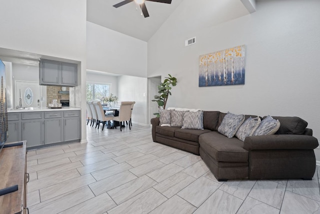 1002 Parkside Cir, Round Rock, TX 78664 - living room featuring ceiling fan and high vaulted ceiling