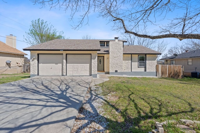 1002 Parkside Cir, Round Rock, TX 78664 - view of front facade with concrete driveway, an attached garage, a chimney, and stone siding