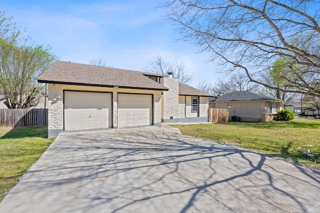 1002 Parkside Cir, Round Rock, TX 78664 - view of front of property with a garage, driveway, stone siding, a chimney, and roof with shingles