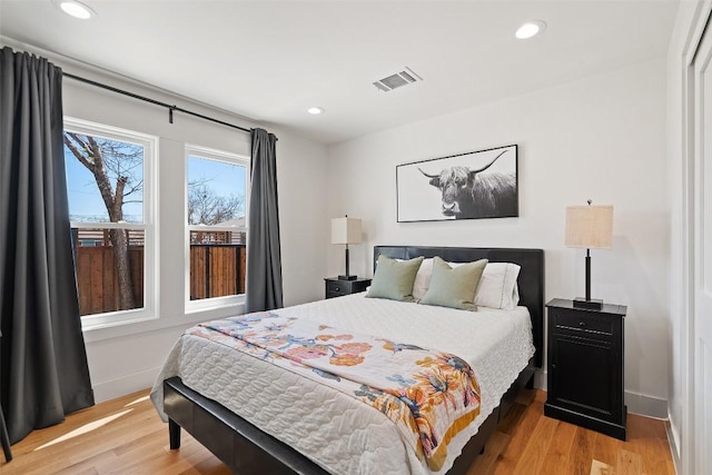 703 E 15th St, Georgetown, TX 78626 - bedroom with light wood-type flooring and recessed lighting