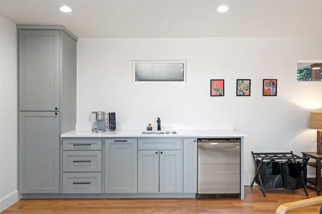 703 E 15th St, Georgetown, TX 78626 - bar with a sink, dishwasher, light wood-type flooring, recessed lighting, and baseboards