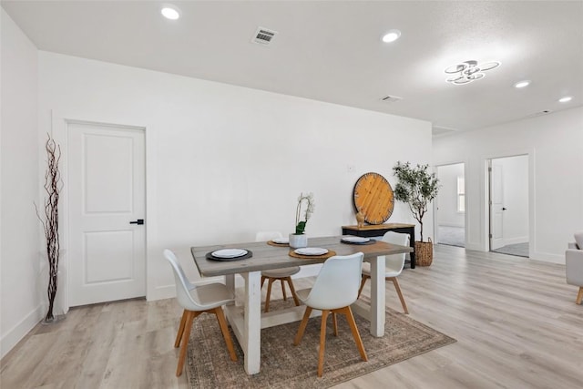 195 Bianca Cir, Del Valle, TX 78617 - dining space with light wood finished floors and recessed lighting