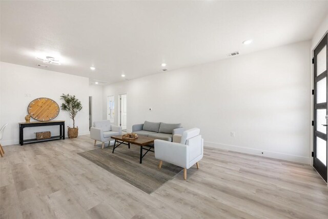 195 Bianca Cir, Del Valle, TX 78617 - living area featuring light wood-style flooring and recessed lighting