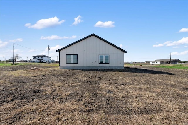 195 Bianca Cir, Del Valle, TX 78617 - view of side of home featuring board and batten siding
