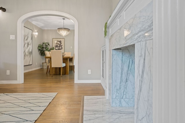 2110 Travis Heights Blvd, Austin, TX 78704 - foyer featuring wood finished floors, arched walkways, ornamental molding, and baseboards