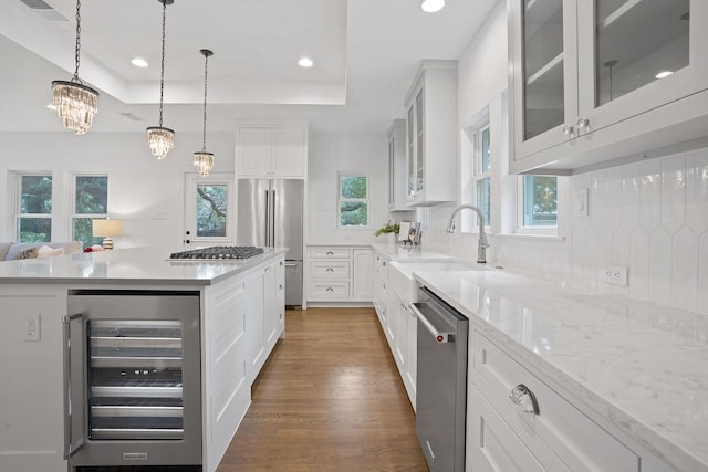 2110 Travis Heights Blvd, Austin, TX 78704 - kitchen featuring wine cooler, appliances with stainless steel finishes, a sink, dark wood finished floors, and recessed lighting
