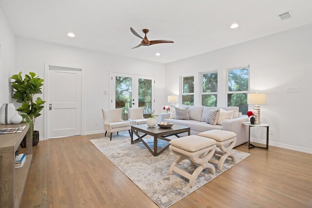 2110 Travis Heights Blvd, Austin, TX 78704 - living area with ceiling fan, wood finished floors, baseboards, recessed lighting, and french doors