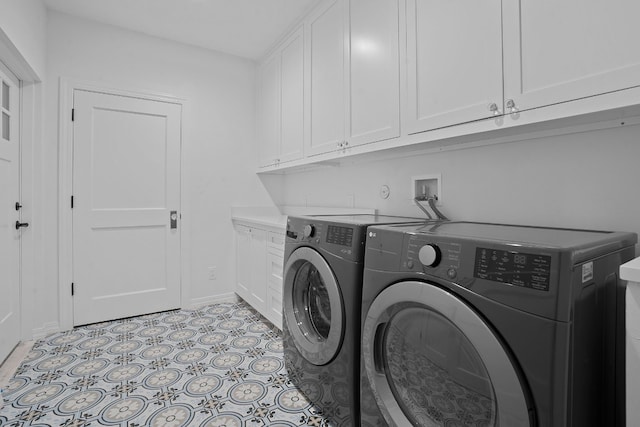 2110 Travis Heights Blvd, Austin, TX 78704 - laundry room featuring cabinet space, washing machine and clothes dryer, and baseboards
