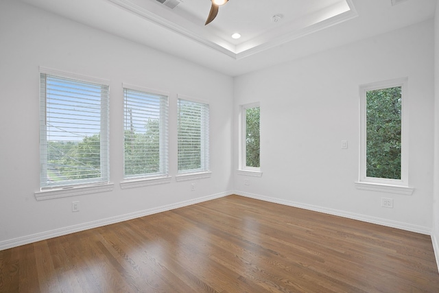 2110 Travis Heights Blvd, Austin, TX 78704 - unfurnished room with ceiling fan, wood finished floors, a raised ceiling, and baseboards
