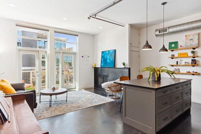 1601 E Cesar Chavez St Unit 202, Austin, TX 78702 - living area featuring finished concrete flooring and recessed lighting