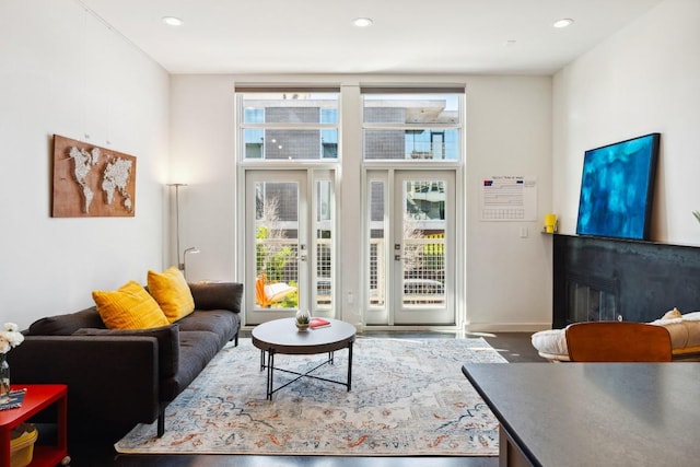 1601 E Cesar Chavez St Unit 202, Austin, TX 78702 - living area with recessed lighting, a glass covered fireplace, and wood finished floors