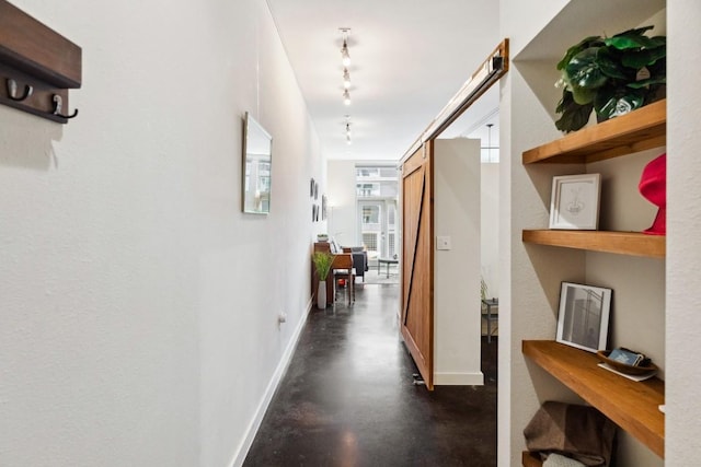 1601 E Cesar Chavez St Unit 202, Austin, TX 78702 - corridor with finished concrete floors and rail lighting