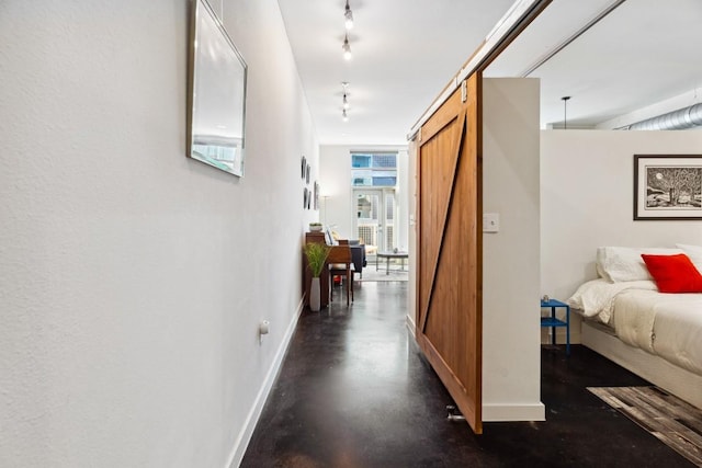 1601 E Cesar Chavez St Unit 202, Austin, TX 78702 - corridor with baseboards and concrete floors